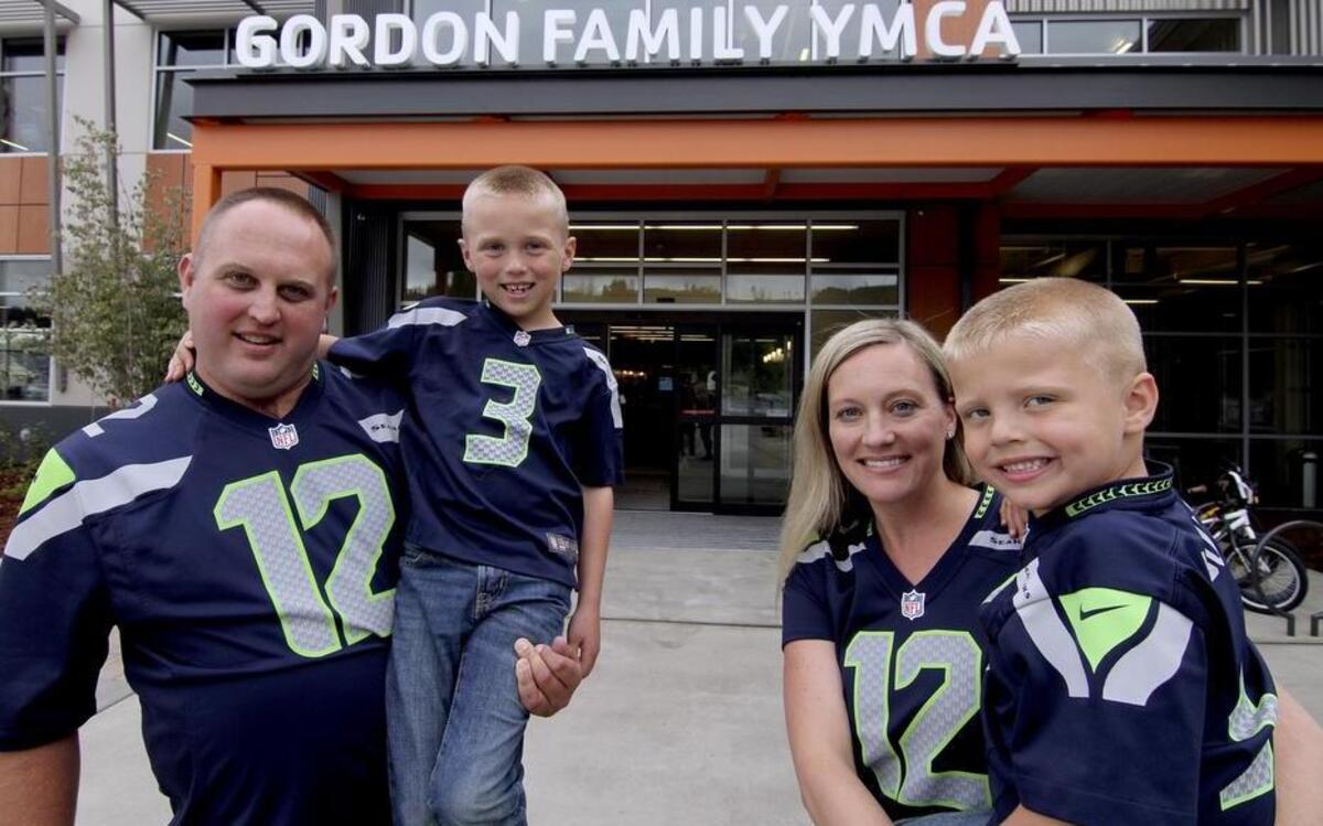
The new Gordon Family YMCA in Sumner has a dedicated group of supporters, including the Hardtke family, the first charter members to sign up for the community hub. Kyle, left, with son Hudson, wife Julana and son Nash were at the YMCA on Friday afternoon.
