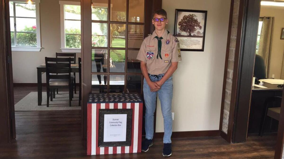 Elliot Crouch-Goodhue created a community flag collection box as part of his Eagle Scout project, which was placed at the Sumner Cemetery, its permanent home.
