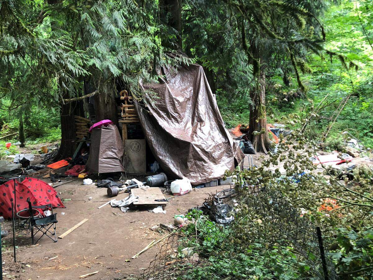 Comprehensive Life Resources Outreach Team visited a homeless encampment on June 22, 2018 near the Foothills Trail in Puyallup.
