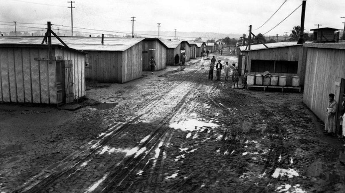 A photo showing Camp Harmony’s “Main Street” in spring 1942. The camp, located on the Puyallup fairgrounds, was the state’s only Japanese internment camp during World War II.
