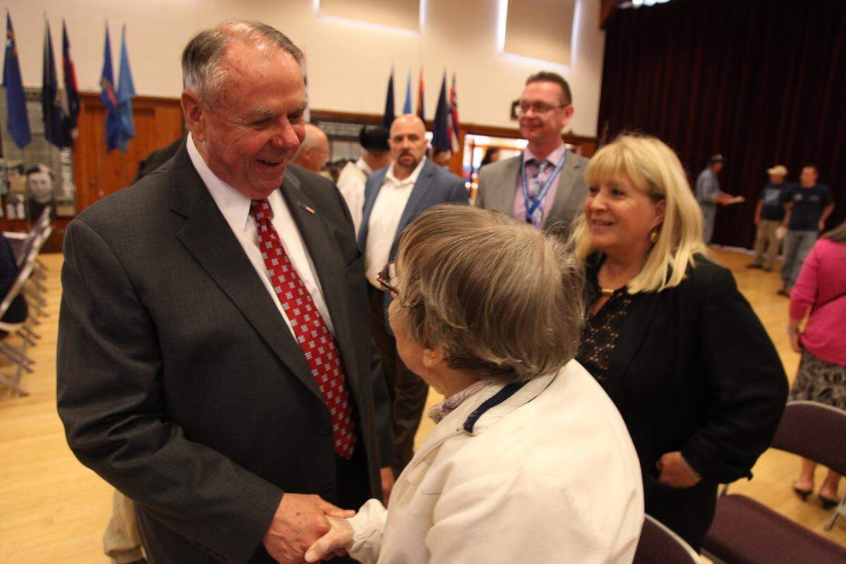 Regional WestCare Vice President Ray Switzer greets a woman attending the Betsy Ross Hall open house on June 26, 2018. WestCare Foundation and the Washington Department of Veterans Affairs partnered to open the Betsy Ross Hall program, providing transitional housing to homeless women veterans.