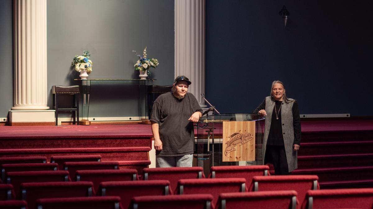 Sylvia Miller, vice chairwoman of the Puyallup Tribe of Indians, right, and funeral services coordinator Daniel McCloud stand at the podium in the Tribe’s new funeral home in Tacoma. The Tribe purchased the property, formerly the Tacoma Christian Center, for $5.7 million in February.