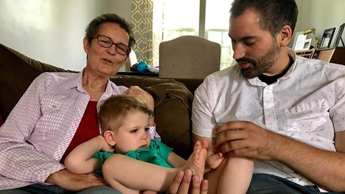 Carlos Romero, right, with Linda Taylor, left, and Noah Linsky, center, who supported Romero when he competed in the ParaClimbing World Championship. Romero, who was diagnosed with facioscapulohumeral muscular dystrophy (FSHD) when he was 28, inspires 5-year-old Noah, who has infantile FSHD.