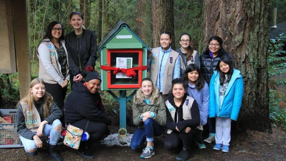 From left, Madelyn Mann, Ashleigh Ladely, Maia Newell, Ashlynn Sutton, Abbie Sutton, Amari Lewis, Kyla Rodrick, Isabelle Tague, Kavindra Shah, Trishna Shah and Leela Shah are members of Puyallup Girl Scout Troop #59690. In January, they installed a Little Free Library in Wildwood Park.