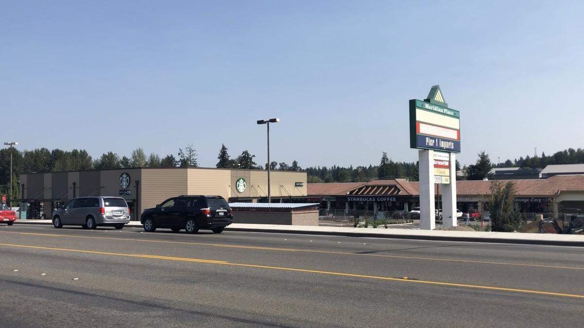 A view from South Meridian in South Hill shows two Starbucks locations in one shopping complex. The Starbucks at 4423 S. Meridian is expanding to include a drive-thru.