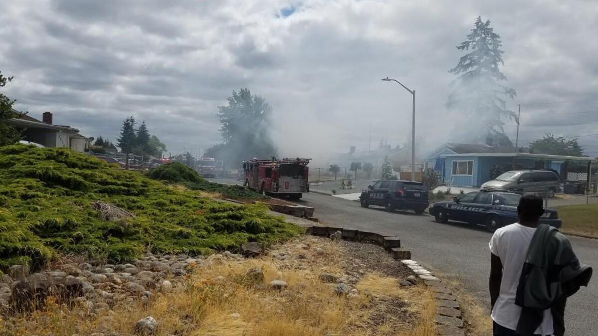 West Pierce Fire and Rescue respond to a house fire on Occident Street Southwest in Lakewood near Bridgeport Way on Saturday.