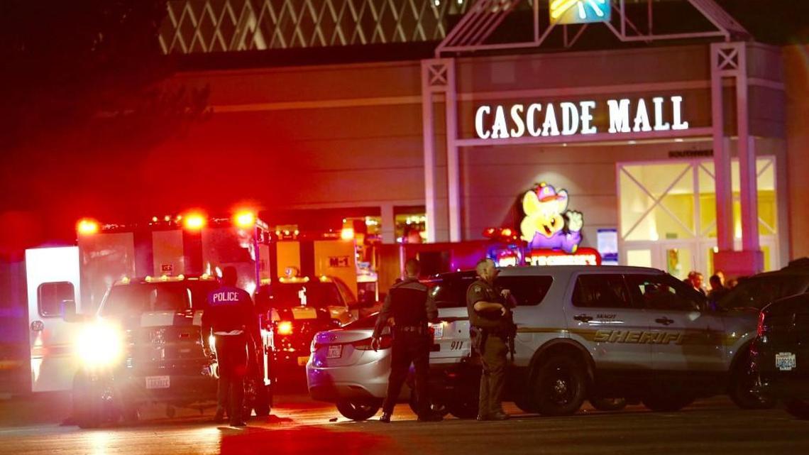 Law enforcement officers work at the crime scene outside of Cascade Mall in Burlington, Wash., where several people were fatally shot on Friday, Sept. 23, 2016. Authorities in Washington State say several people have been killed during a shooting at the mall north of Seattle and that at least one suspect remains at large. Sgt. Mark Francis says authorities are searching for a man wearing gray who was last seen walking toward Interstate 5 from the mall.