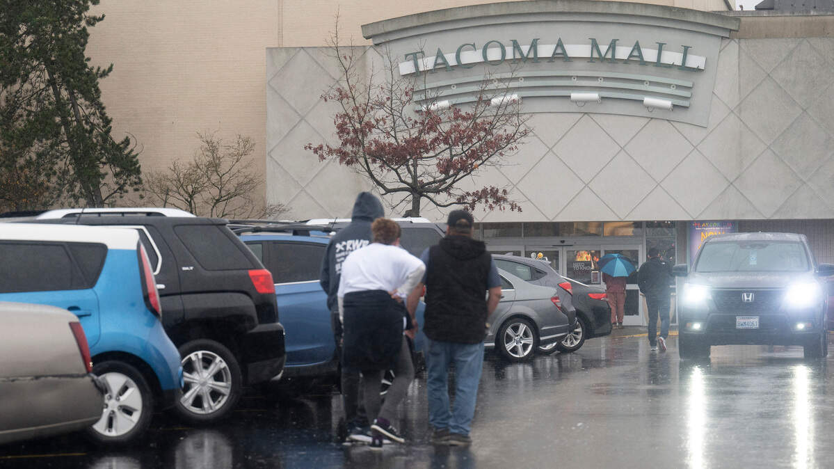 People walk into the east entrance of the Tacoma Mall. A new JD Sports is planned for the mall.