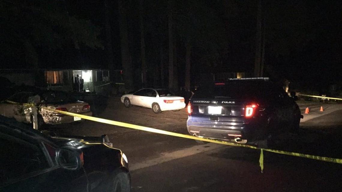 Officer Darrell Moore’s Lakewood police cruiser is parked at the scene of an officer-involved shooting south early Sunday of Port Orchard. Moore shot a man later arrested for unlawful possession of a firearm, according to Kitsap County Superior Court charging documents.