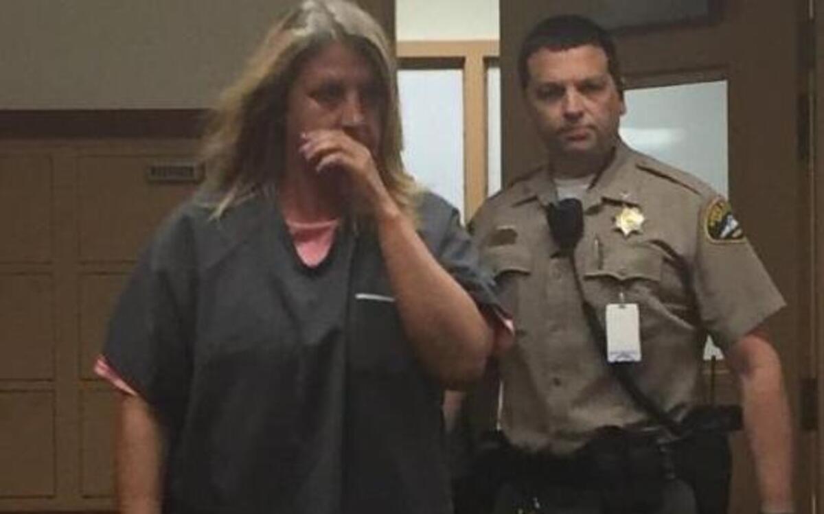 Shelley Lehman is brought into Pierce County Superior Court in Tacoma on Friday afternoon. The credit union teller is accused of stealing $42,000 from an Alzheimer’s patient’s account.