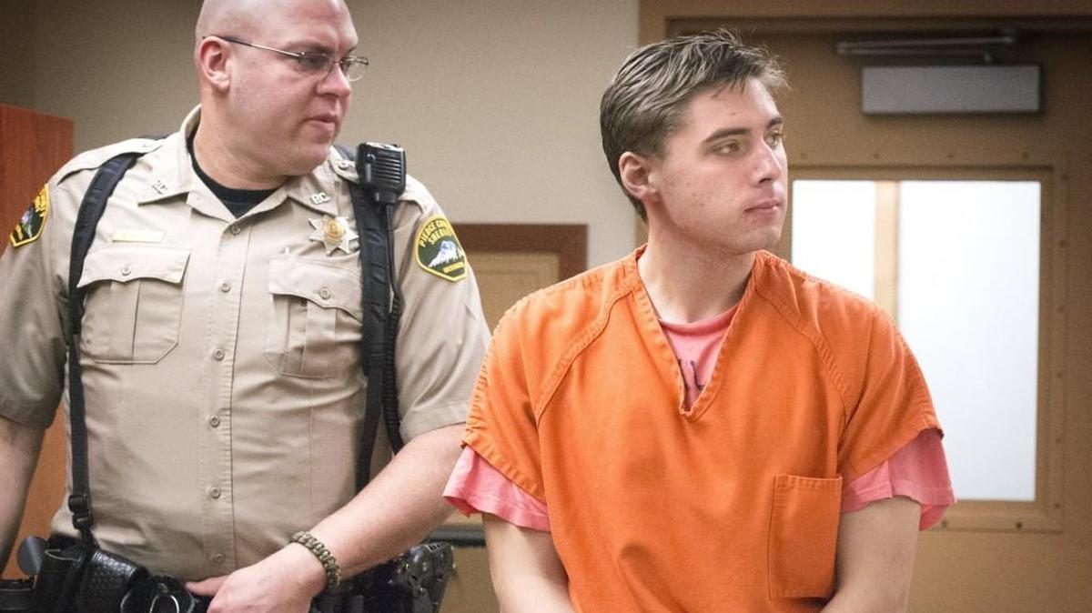 Jesse Matthew Suhanec walks into a courtroom escorted by Pierce County sheriff personnel in Pierce County Superior Court Monday. Suhanec was charged charged with first- and second-degree assault, three counts of attempted first-degree robbery, and one count of attempted first-degree burglary.