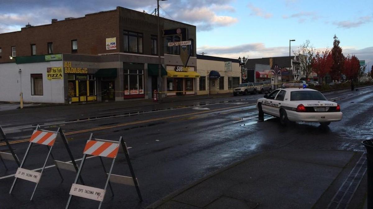 Tacoma Police investigate the scene of a shooting Sunday morning in the 5200 block of South Tacoma Way.
