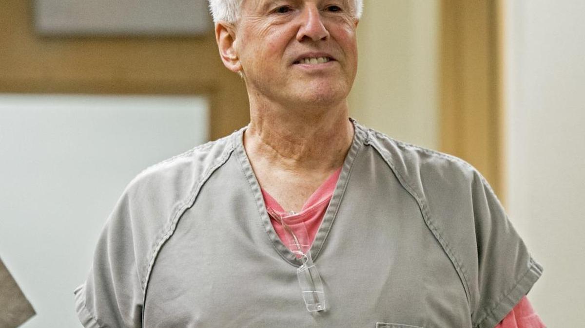 Steven Craig Powell enters Pierce County Superior for an arraignment on charges of possessing child pornography, October 28, 2014.