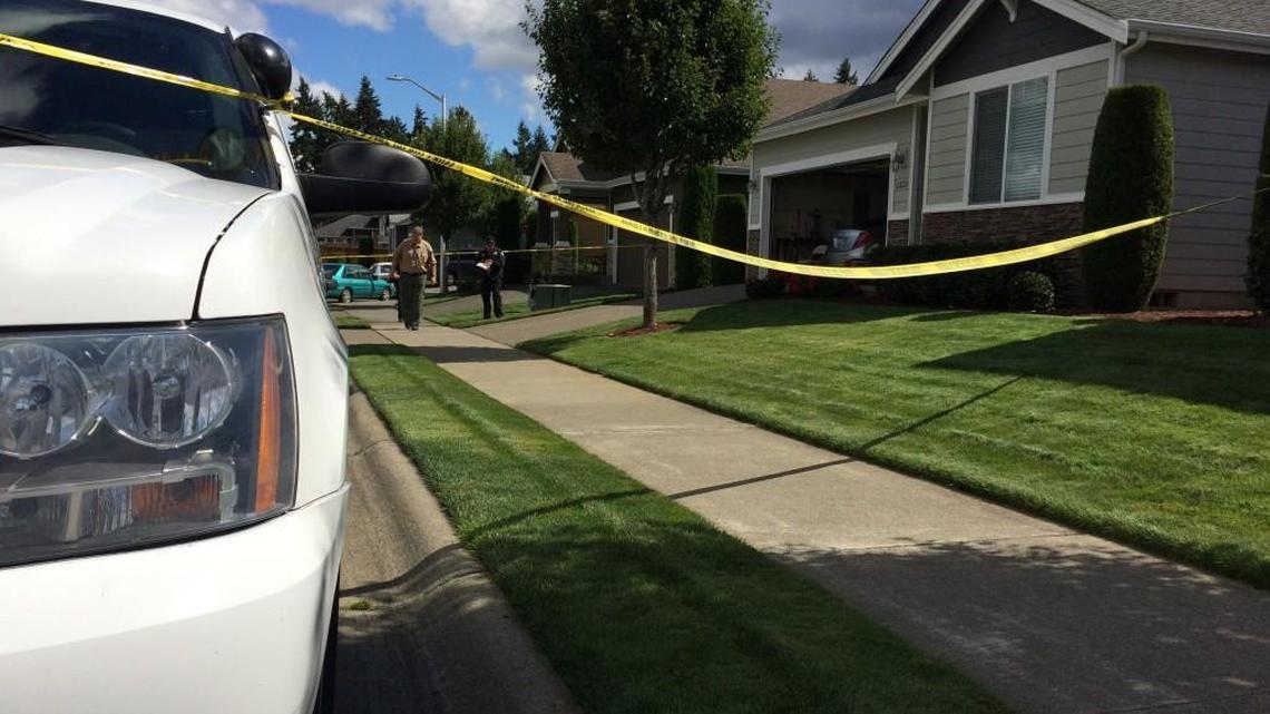 Pierce County Medical Examiner staff members arrive on scene of a homicide-suicide in Spanaway on Friday.