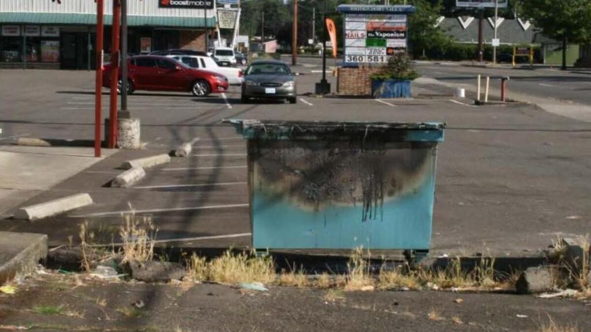 This dumpster was set on fire early July 14 as part of a spree of small arson fires along Bridgeport Way Southwest in Lakewood, according to police there.