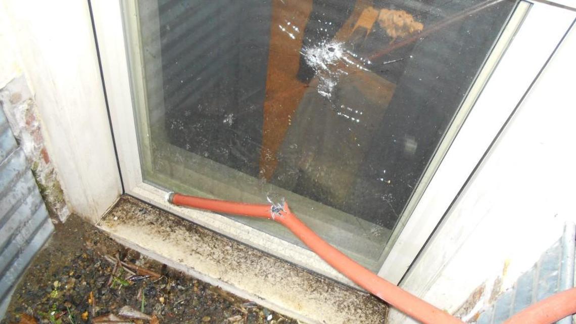 A Spanaway man shot a suspected burglar through this window Feb. 19 after he found the prowler crouched outside the room where his infant and toddler had been sleeping.