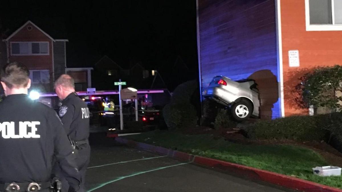 A Kent man was killed Saturday after a small car crashed through the exterior wall of his apartment.