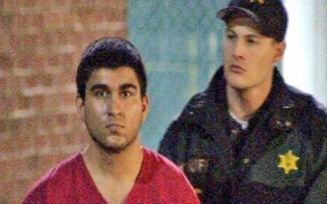 This late Saturday, Sept. 24, 2016, image from video by KIRO7 photographer Jeff Ritter shows suspected Cascade Mall shooter Arcan Cetin at Skagit County Jail in Mount Vernon, Wash., after his arrest in Oak Harbor, Wash., earlier in the evening. Investigators on Sunday tried to piece together information on the 20-year-old suspect in the deadly Washington state mall shootings who was apprehended after a nearly 24-hour manhunt. (Jeff Ritter/KIRO7.com via AP)