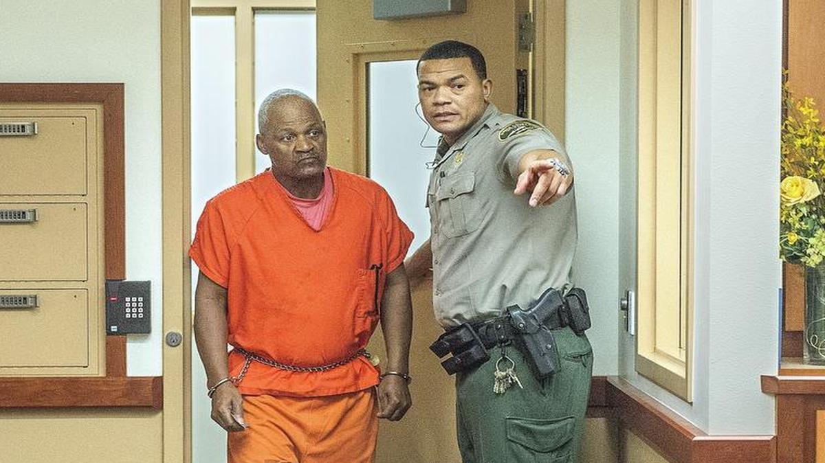 
Stanley Guidroz, left, is lead into Pierce County Superior Court in February to face a manslaughter charge in the 1983 disappearance of his 3-year-old son, Wallace. The boy's body was never found.
