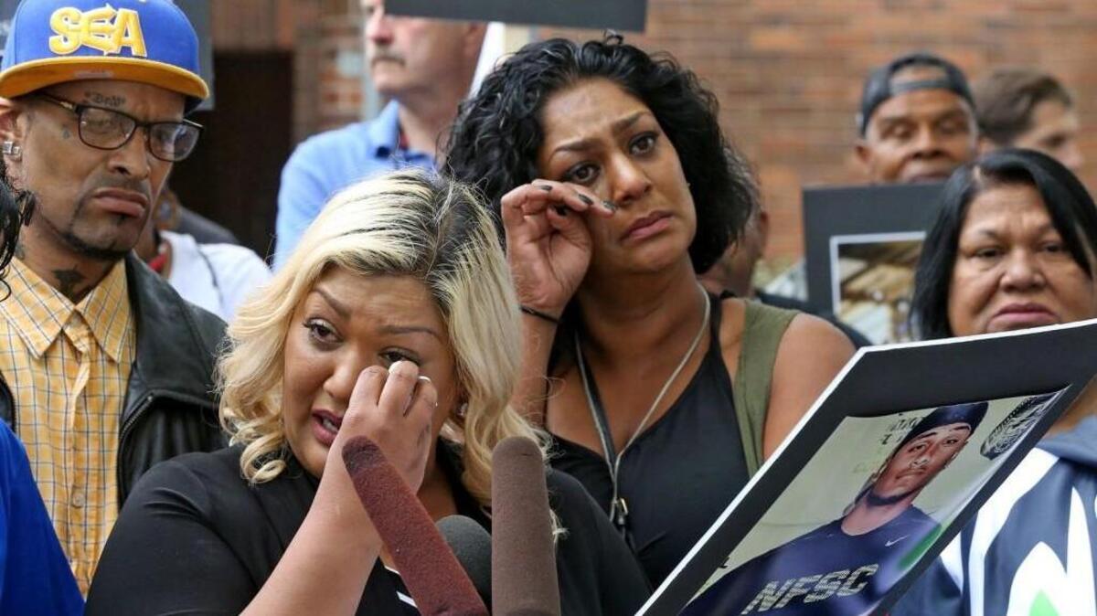 Sonia Joseph, foreground, tearfully talks about her son, 20-year old Giovonn Joseph-McDade, who was shot by Kent Police on June 24. At right is his aunt Saima Joseph.