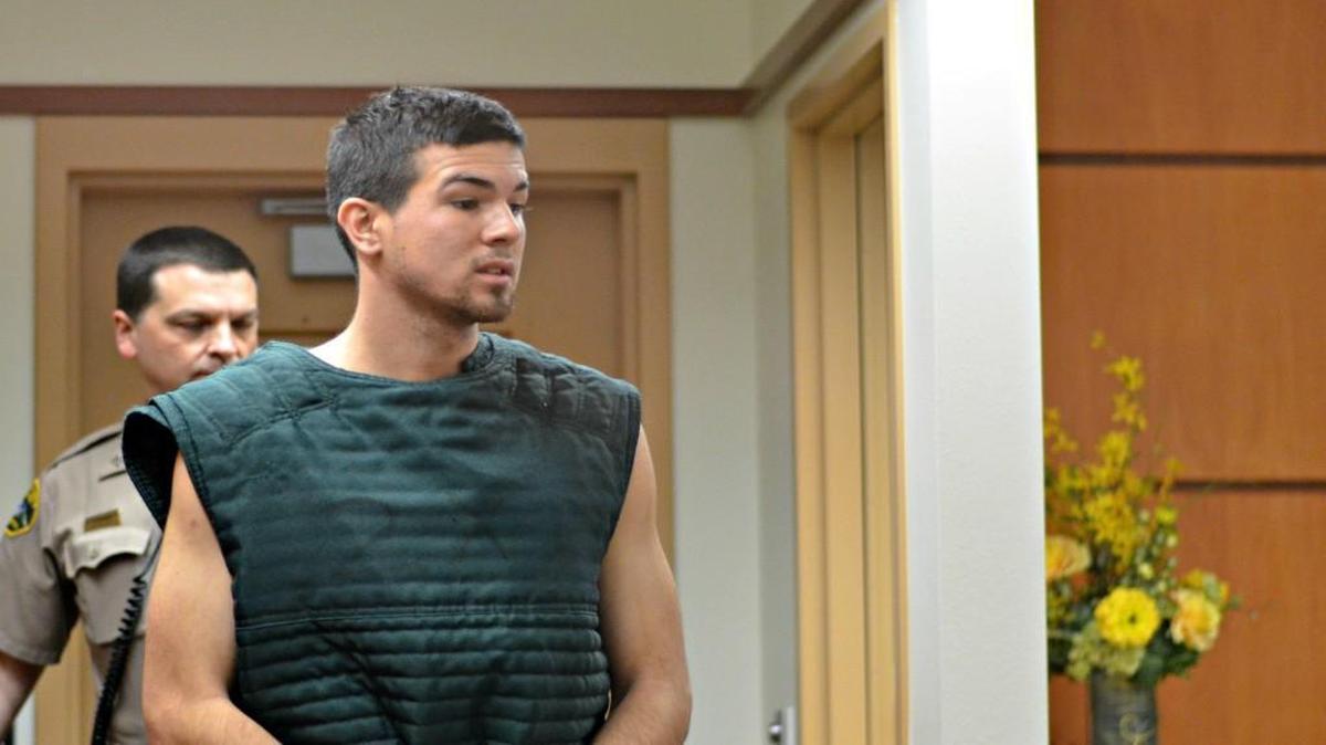 Joshua J. Roberts is led into Pierce County Superior Court for arraignment on a manslaughter charge on Wednesday.