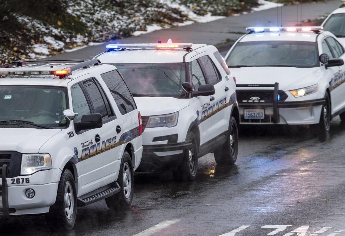 Tacoma police vehicles join the procession for slain Tacoma police Officer Reginald “Jake” Gutierrez in Tacoma on Dec. 8.