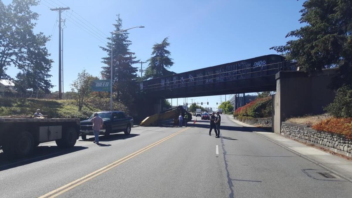 A semitrailer hit a railroad trestle near the Lakewood Sounder Station Monday.