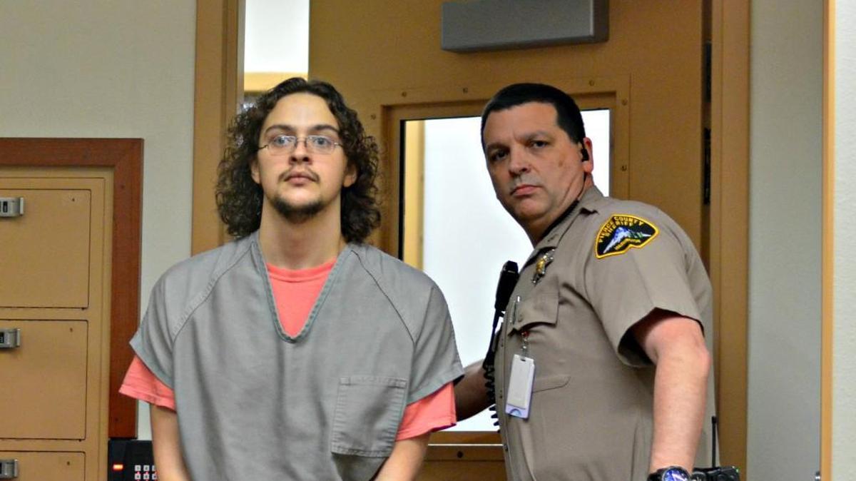 Brett Dollens is led into Pierce County Superior Court for his arraignment Dec. 7, 2015.
