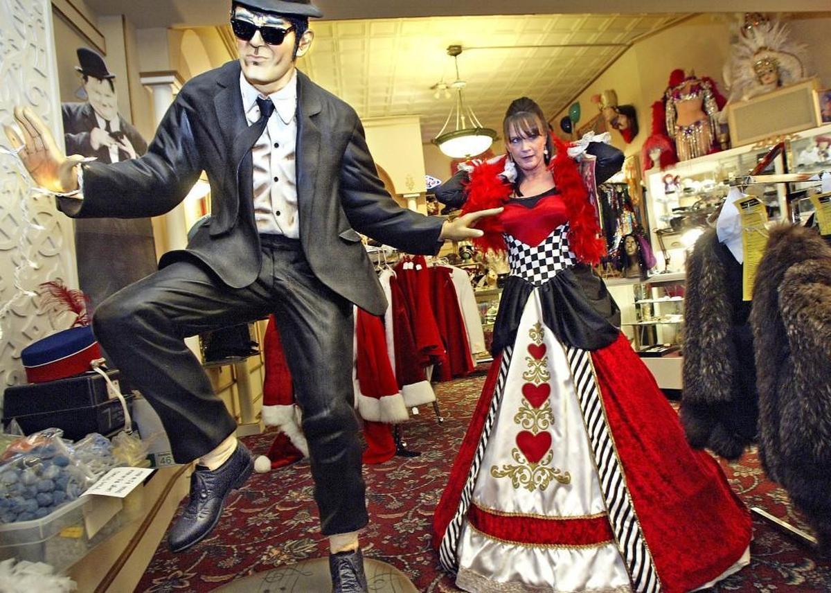 In 2009, C.J. Jensen of Puyallup tried on a feather scarf borrowed from Elwood Blues to compliment her "Queen of Hearts," costume she picked out at Northwest Costume on 6th Ave. Jensen was looking for a costume for a Halloween office party.