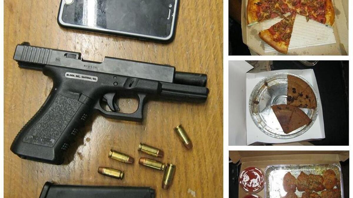 The confiscated gun, cell phone and food from an alleged robber in University Place Friday evening.