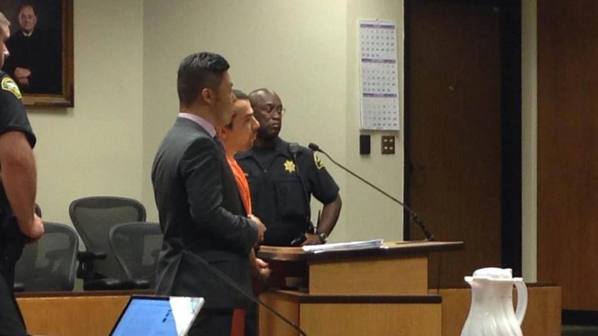 Farokh Jalil-Al-Ghadr (in orange) last appeared in court on Aug. 1, 2015, with public defender Andrew Yi, left.