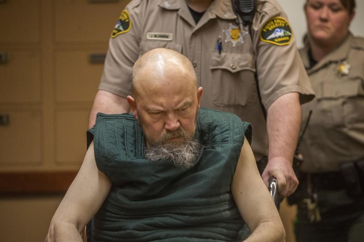 Kurt Otto Youngers is wheeled into his arraignment in Pierce County Superior Court on Friday to face a charge of first-degree murder in the shooting death of his father.