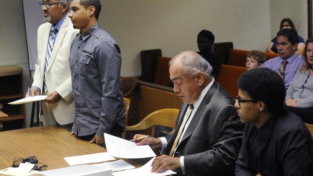 
Andre Thompson, second from left, and Bryson Chaplin, right, appear Tuesday before Thurston County Superior Court Judge Gary Tabor during their arraignment on assault charges. Both entered not guilty pleas. They were represented Tuesday by attorneys Daryl Rodrigues, director of the Office of Assigned Counsel, left, and George Paul Trejo Jr.
