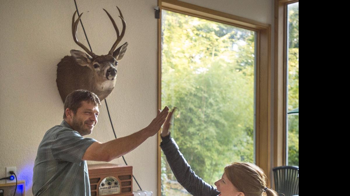 
Actor Jason Stange of Olympia high fives co-star Katie Hemming after diagraming her attempted murder during filming for the movie "Marla Mae" in Olympia on Tuesday, July 21, 2015.
