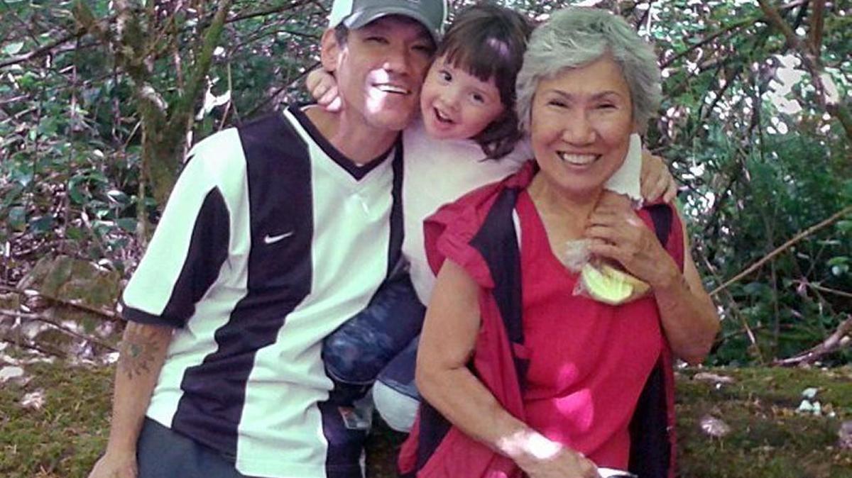 Earl Switzer, 45, with his niece and his mother ,Yong Switzer.