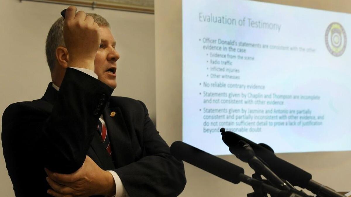 
Thurston County Prosecutor Jon Tunheim indicates where one of the bullets struck a man on May 21. Tunheim announced Wednesday afternoon that Olympia Police Officer Ryan Donald will not face criminal charges for shooting two skateboarders after responding to a theft call.
