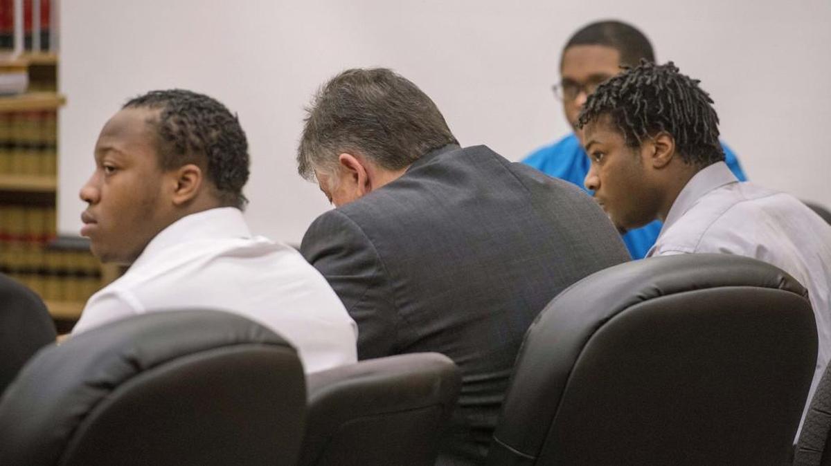 Three men accused in the fatal shooting of Brandon Morris flank defense attorney Peter Connick, second from left, prior to closing arguments in Pierce County Superior Court on Monday. From left: Jermohnn Gore, 17; Connick; Alexander Kitt, 24, and Clifford Krentkowski, 18, partially obscured. The three were found guilty of first-degree murder and other charges Thursday.