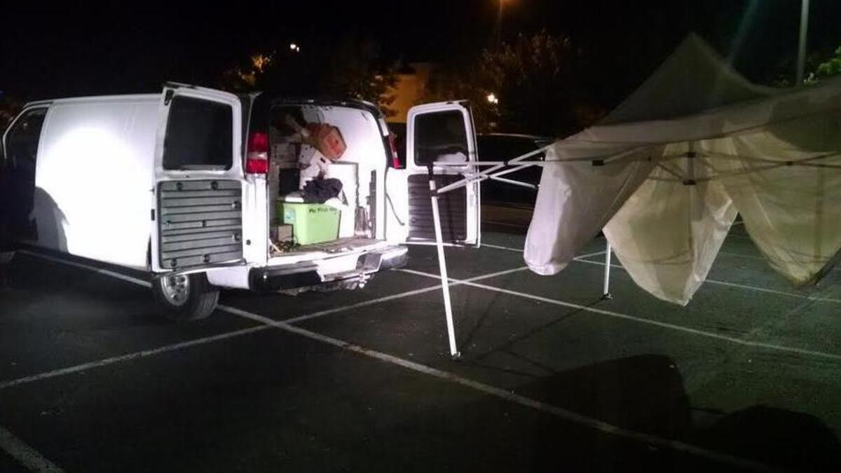 
Lakewood Police examine Moua Vang’s van. 
