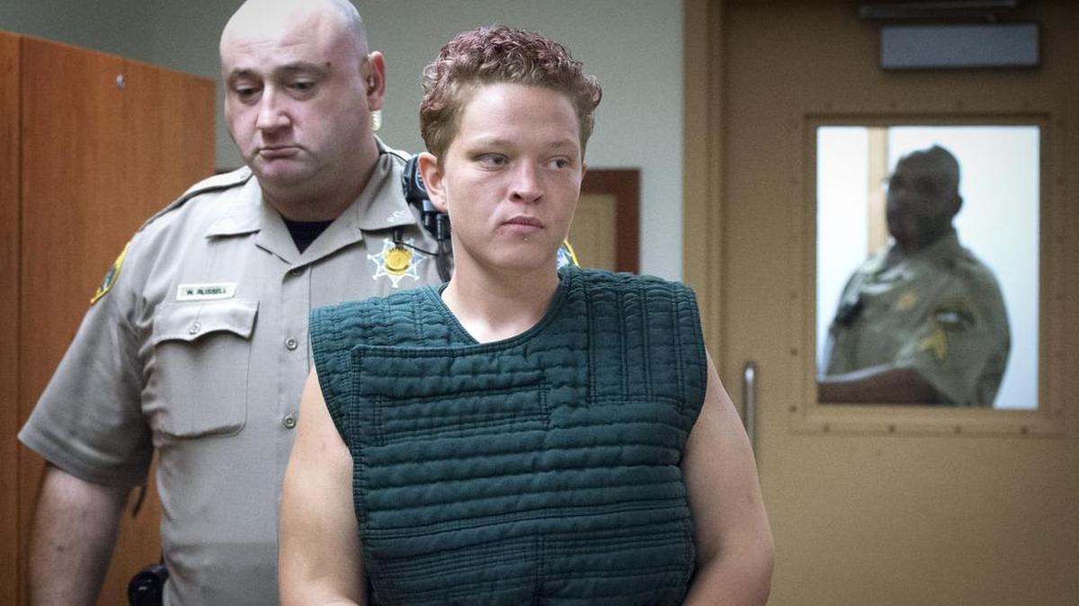 Kady Jo Paxton is escorted by Pierce County Correctional Officers on Friday for her first court appearance in connection with an attack on a jail deputy. The Sheriff’s Office said Paxton lured a deputy to her cell with a ruse, then tried to strangle her with a knotted towel.
