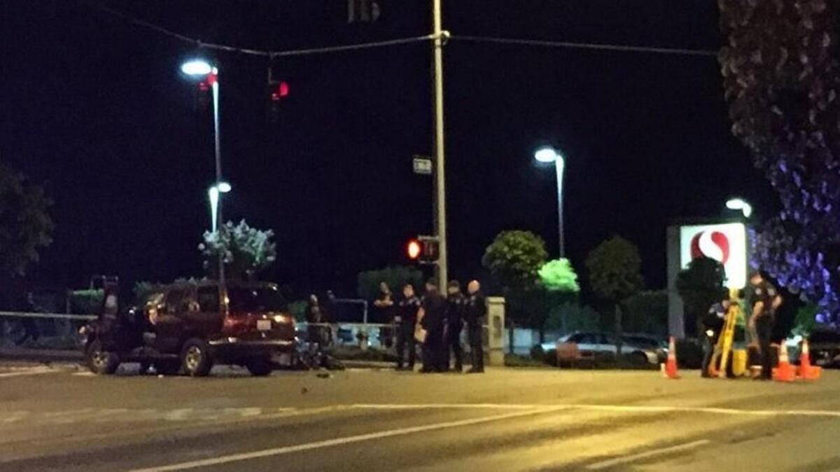 Police investigate the scene of a fatal hit-and-run Wednesday in Tacoma.