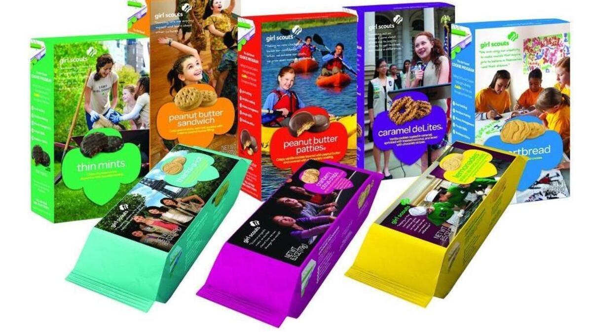 Two people, one with a gun, attempted to rob Girl Scouts selling cookies in front of a Tacoma store on Saturday evening, according to police.