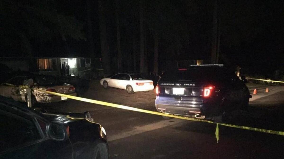 Officer Darrell Moore’s Lakewood police cruiser is parked at the scene of an officer-involved shooting Jan. 29 south of Port Orchard. Kitsap County prosecutors determined Moore was justified in shooting Thomas St. Clair after an altercation, according to a statement released Friday to the Kitsap Sun.