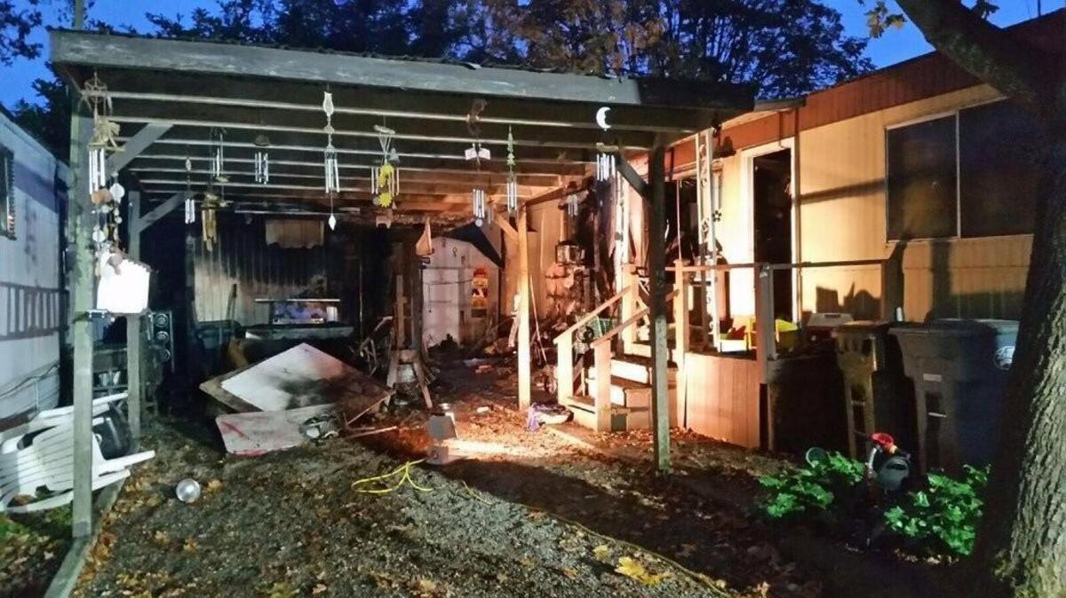 Two cats died and two people were taken to the hospital when a mobile home in Lakewood caught fire early Friday. Investigators suspect it was arson.