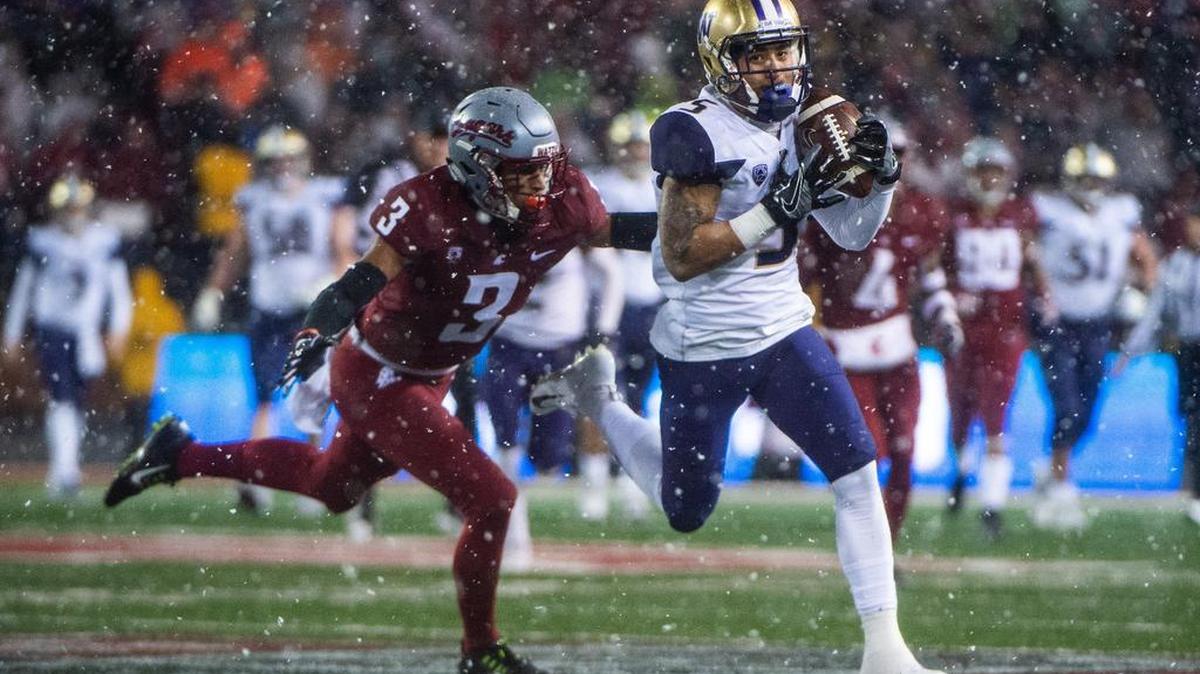Washington wide receiver Andre Baccellia (5) makes a catch in the first quarter. The Washington Huskies played the Washington State Cougars in the Apple Cup at Martin Stadium in Pullman, Wash., on Friday, Nov. 23, 2018.