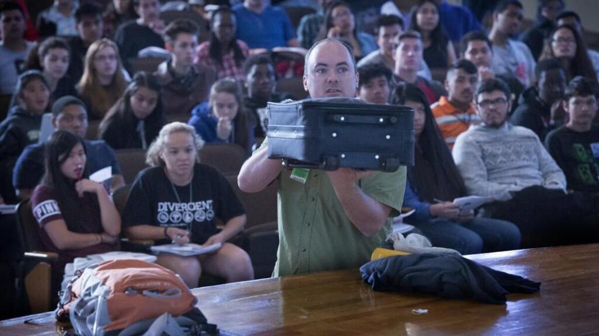 Lincoln High School biology teacher Ben Dotson gives instruction to students who will be making the trip to China on how to pack their luggage for the trip at Lincoln High School on Wednesday, Sept. 14, 2016. Dotson will be a chaperone on the trip.