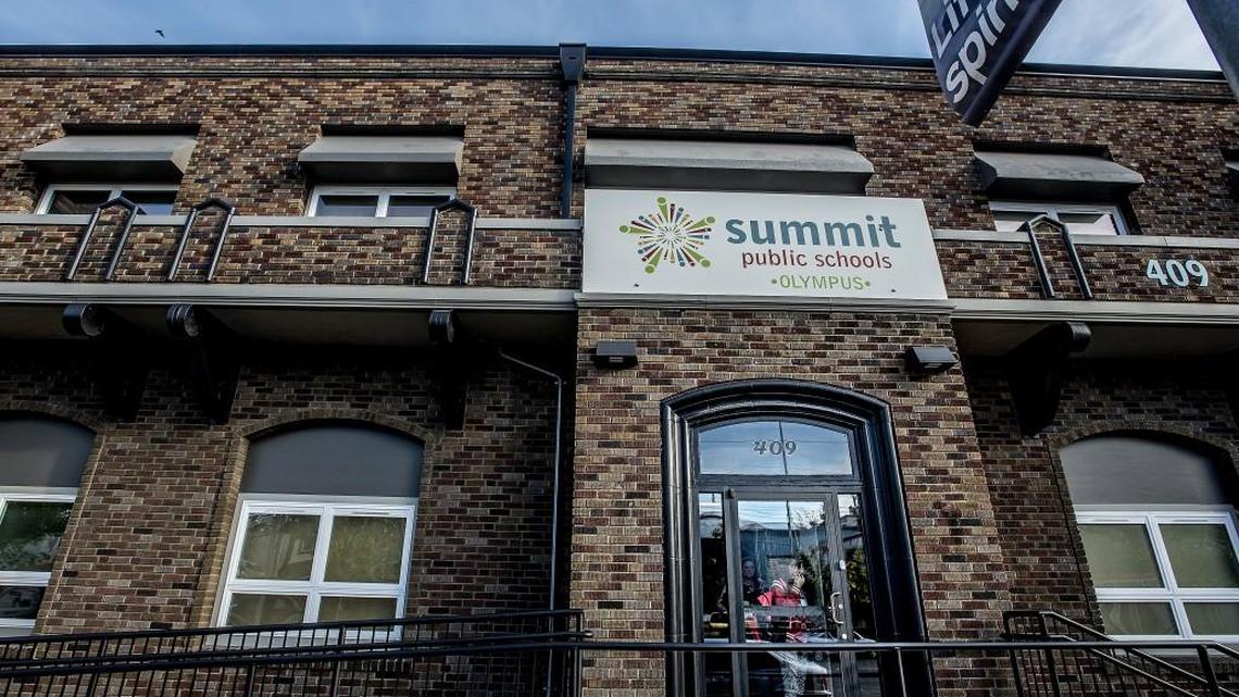 
A student peers outside the front door of Olympus High School in Tacoma, one of three charter schools that opened in Tacoma this year. The Washington State Charter Schools Association has acknowledged that it has not yet raised enough private money to keep Washington charters running for a full school year.
