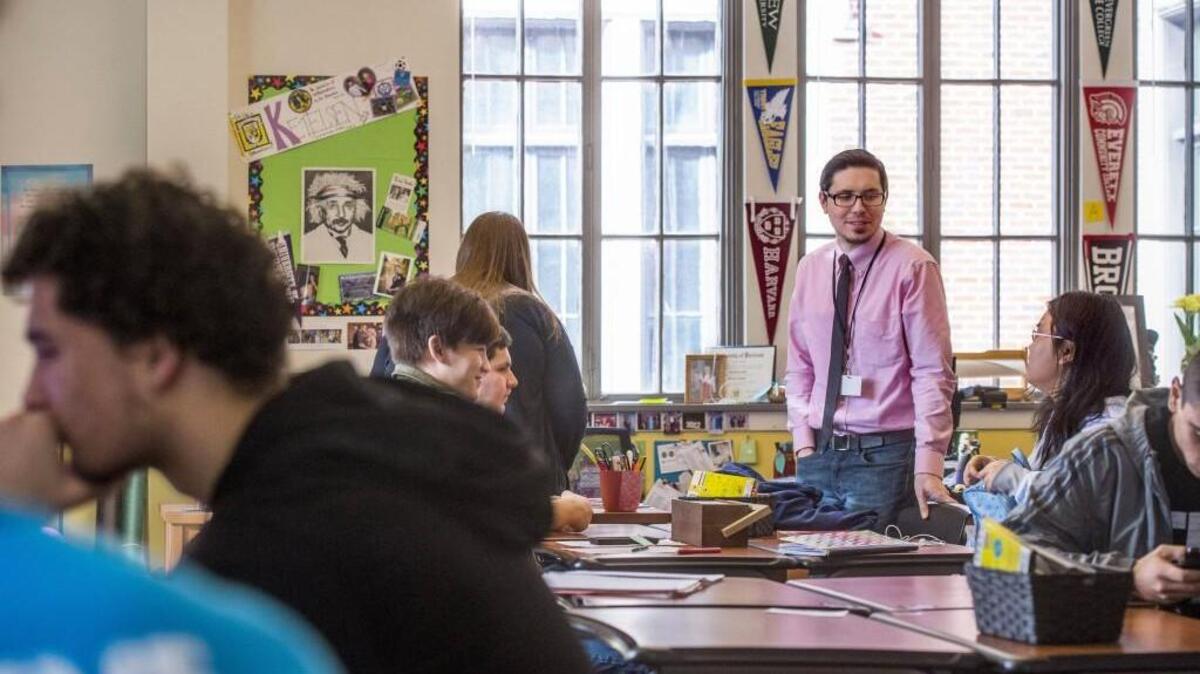 Luke Eudaily, an emergency substitute teacher, works with students who are completing math assignments in a seminar class at Lincoln High School. He has a degree that combines business management and computer networking, but is exploring a possible career switch to teaching. He said he doesn’t use phone apps to get job listings, but works through the district’s Sub Finder system.
