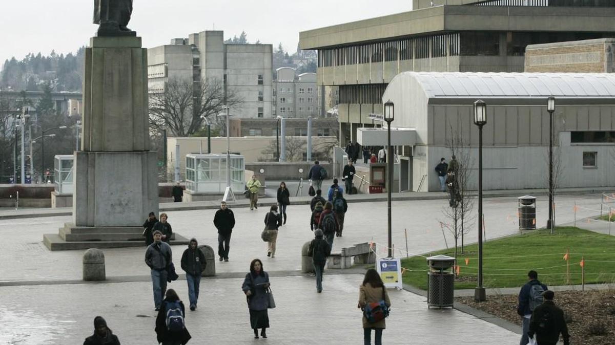Students walk near a statue of George Washington on campus at the University of Washington in Seattle in January 2007.