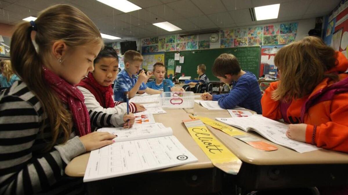 East Olympia Elementary School third-grade students work on their math projects.