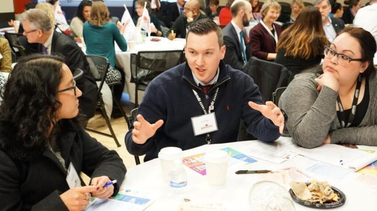 Kyle Roffler from the Metropolitan Development Council makes a point during a group discussion of this year’s Graduate Tacoma report.